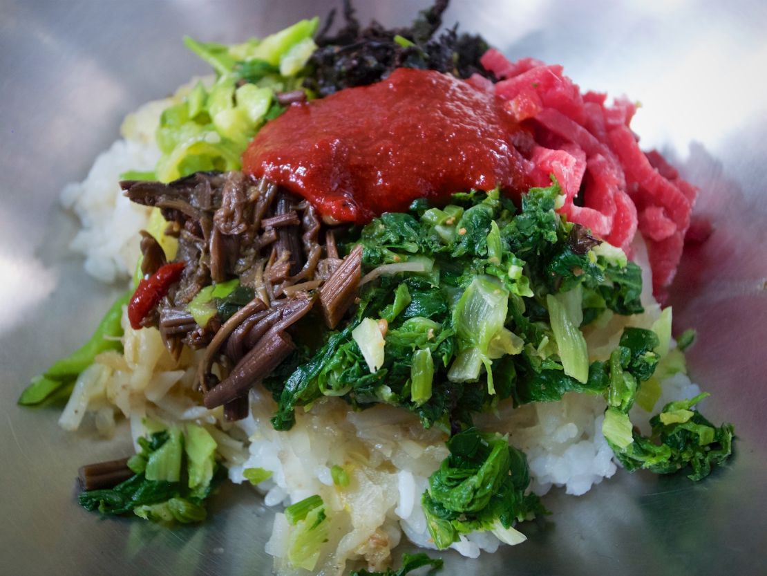 Jinju's unique bibimbap comes with "yukhoe" -- raw strips of julienned beef.
