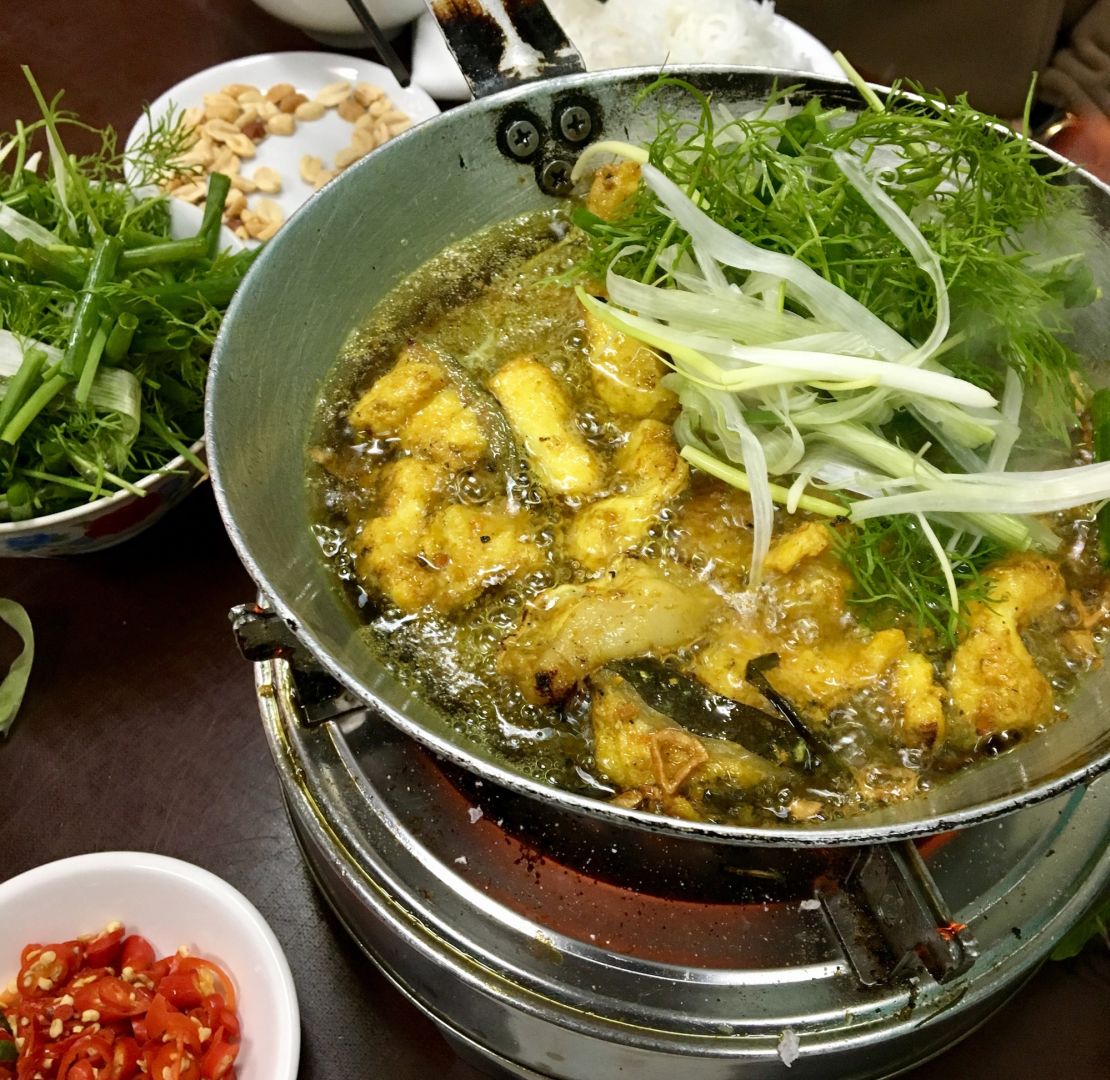 There's a street in Hanoi that's entirely dedicated to  chả cá --  a vermicelli noodle dish with turmeric-spiced catfish that diners grill themselves.  