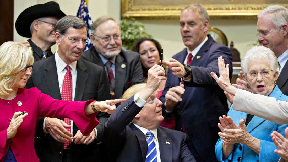 President Trump gives away a pen after signing a bill Monday, March 27, that overturned a rule on school accountability standards. Trump <a href="http://www.cnn.com/2017/03/27/politics/donald-trump-sign-regulation-obama-roll-backs/" target="_blank">signed four bills</a> Monday to nullify measures that were put in place during the previous administration.