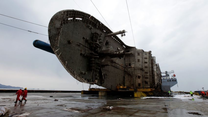 JINDO-GUN, SOUTH KOREA - MARCH 26: In this handout photo released by the South Korean Ministry of Oceans and Fisheries, The sunken Sewol ferry on a semi-submersible transport vessel during the salvage operation in waters off Jindo, on March 26, 2017 in Jindo-gun, South Korea. The Sewol sank off the Jindo Island in April 2014 leaving more than 300 people dead and nine of them still remain missing. Workers are in the process of an attempt to raise the ferry from the water in the hope that the disasters' final victims will be found. (Photo by South Korean Ministry of Oceans and Fisheries via Getty Images)