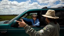 Before heading to her next hunting spot, Donna Kalil, center, chats with fellow python hunter Tom Rahill near Everglades National Park on Thursday, March 30, 2017.Photo by Scott McIntyre for CNN