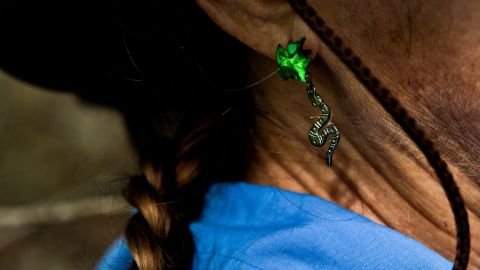 Kalil sports snake earrings during the hunt.