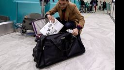 A Libyan traveller packs his laptop in his suitcase before boarding his flight for London at Tunis-Carthage International Airport on March 25, 2017.The United States this week announced a ban on all electronics larger than a standard smartphone on board direct flights out of eight countries across the Middle East, in effect from March 25, 2017. US officials would not specify how long the ban will last, but Emirates told AFP that it had been instructed to enforce the measures until at least October 14. Britain has also announced a parallel electronics ban targeting all flights out of Egypt, Turkey, Jordan, Saudi Arabia, Tunisia and Lebanon. / AFP PHOTO / FETHI BELAID        (Photo credit should read FETHI BELAID/AFP/Getty Images)