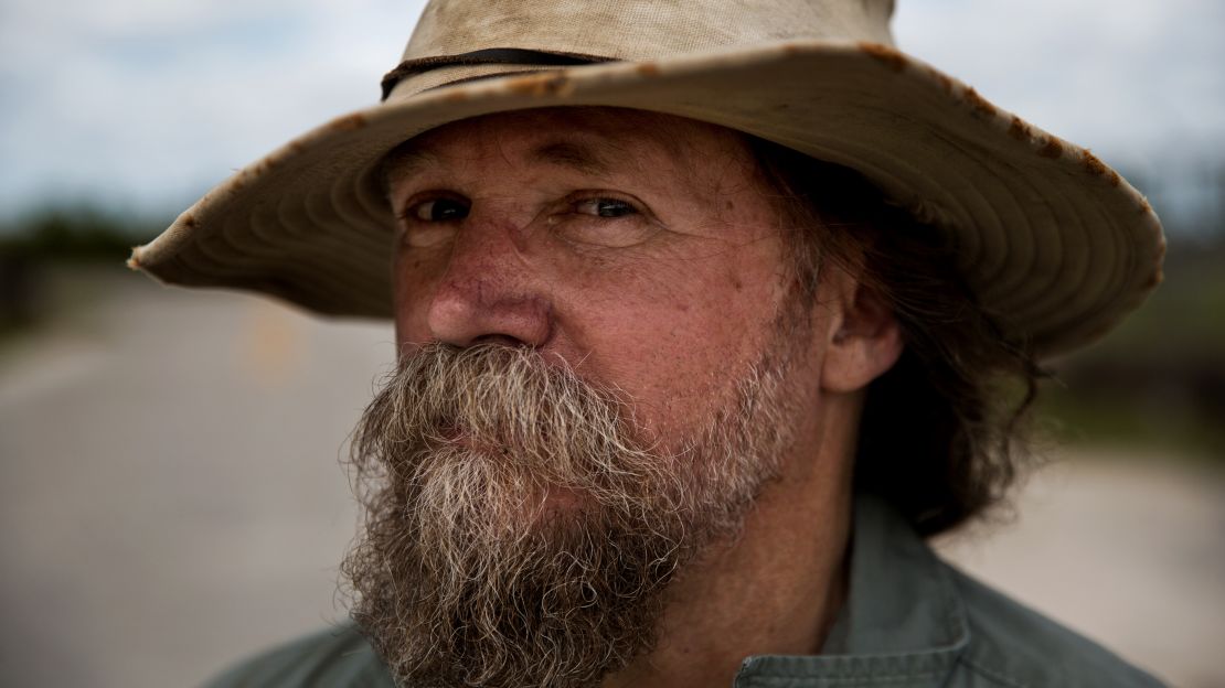 Tom Rahill, founder of the Swamp Apes veterans support group, takes a break during the hunt.