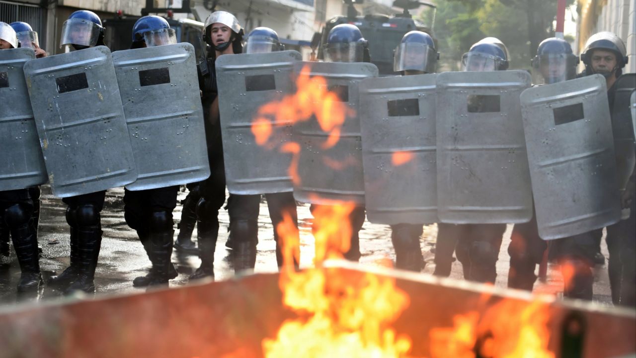 Riot police line up Friday in a crackdown on anti-government protesters in Paraguay's capital.