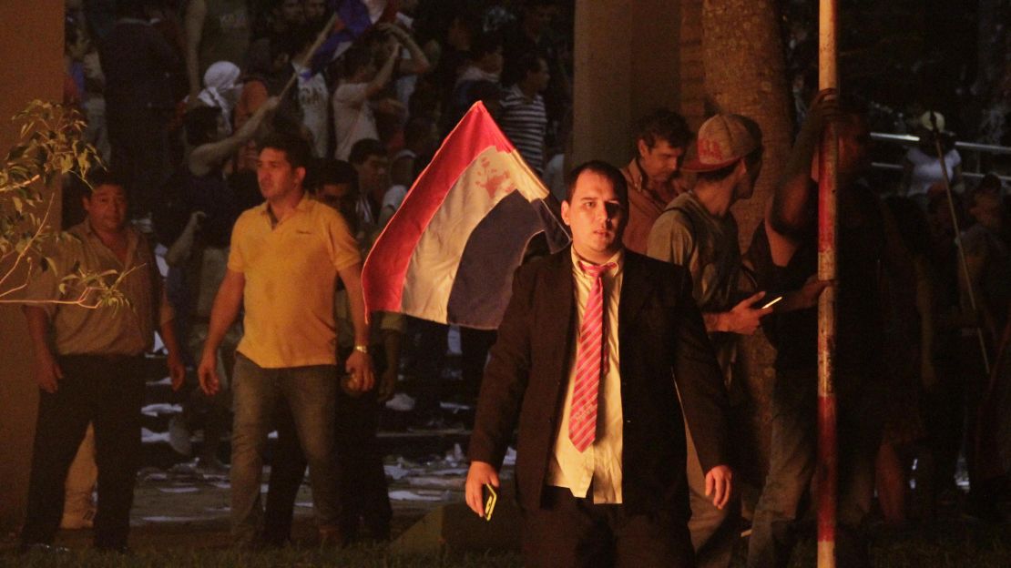 Anti-government protesters storm Paraguay's congressional building Friday night in Asunción.