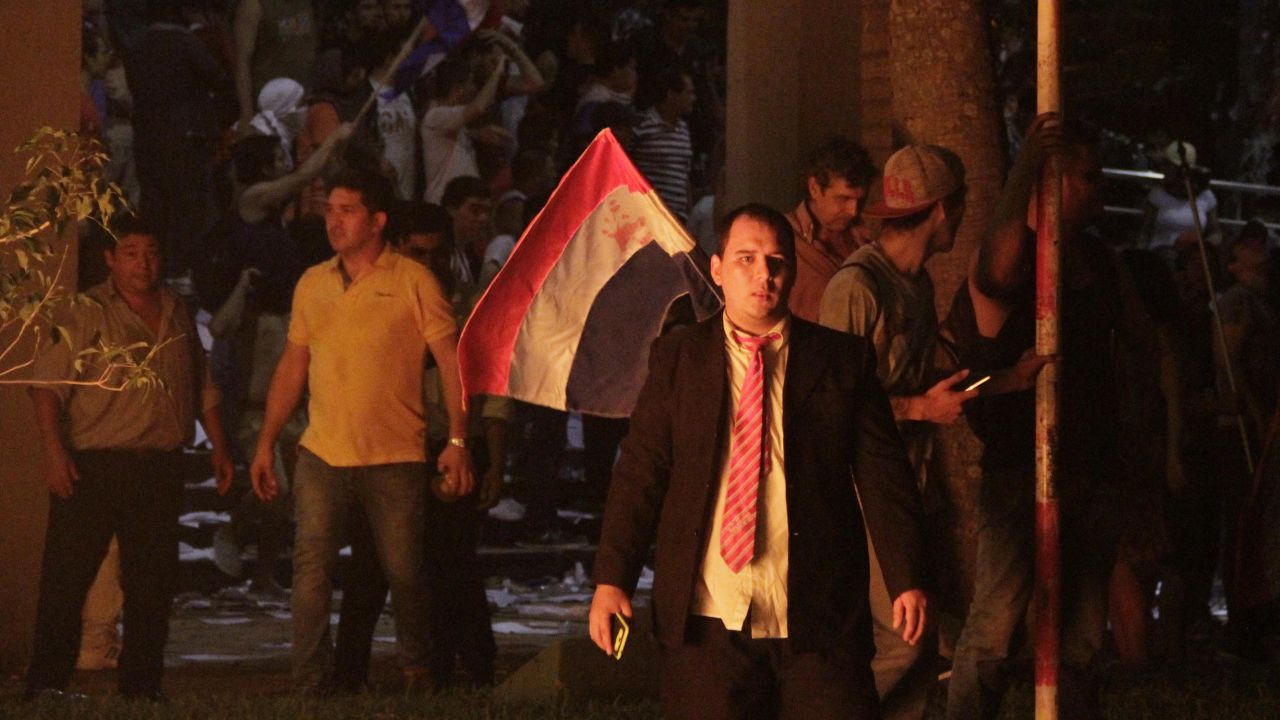 Anti-government protesters storm Paraguay's congressional building Friday night in Asunción.