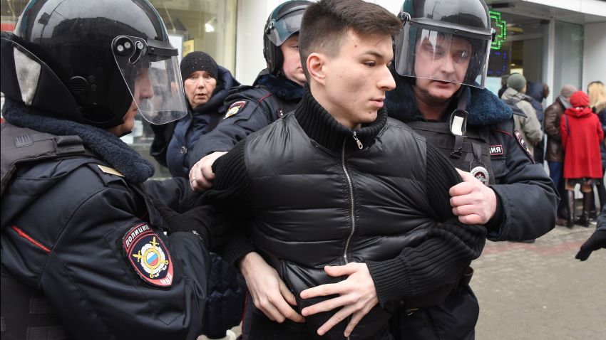 Russian police officers detain a man in central Moscow on April 2, 2017, as Russian opposition promised protests after police detained hundreds of people during anti-corruption rallies.