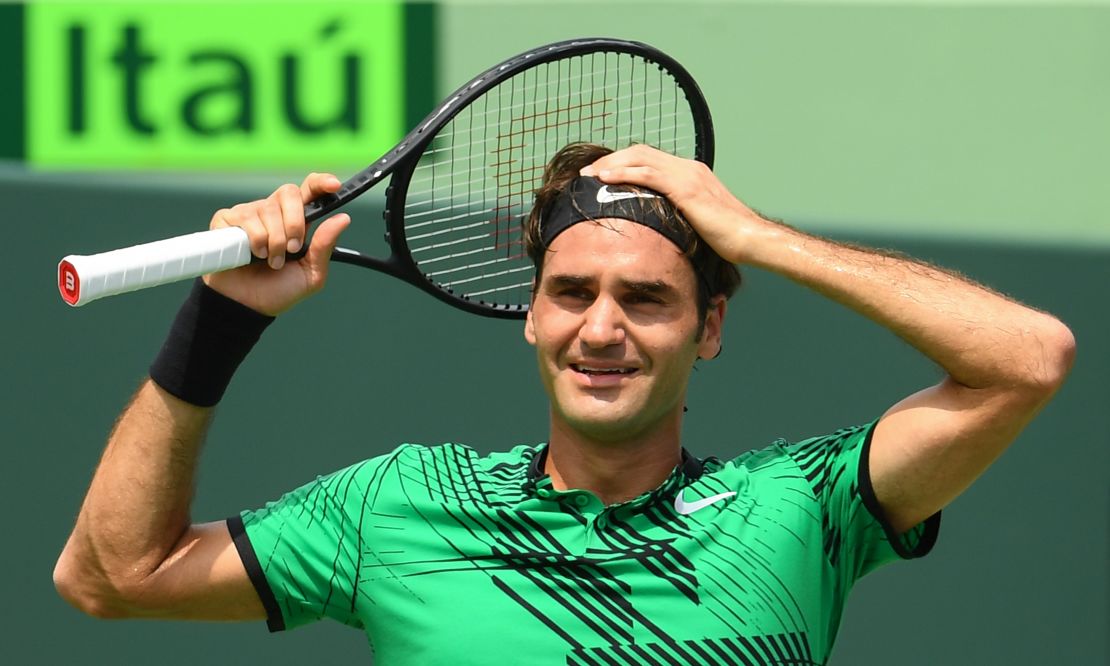 Roger Federer celebrates match point after defeating Rafael Nadal at the Miami Open.