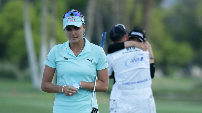 RANCHO MIRAGE, CA - APRIL 02:  Lexi Thompson (L) walks off the 18th green, as So Yeon Ryu of the Republic of Korea celebrates with her caddie after Ryu defeated Thompson in a playoff during the final round of the ANA Inspiration at the Dinah Shore Tournament Course at Mission Hills Country Club on April 2, 2017 in Rancho Mirage, California.  (Photo by Jeff Gross/Getty Images)