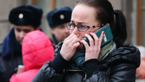 A woman makes a phone call at the entrance to the Tekhnologichesky Institut station.