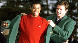 13 Apr 1997:  1996 US Masters winner Nick Faldo of Great Britain helps 1997 winner Tiger Woods of the USA put on the Green Jacket after Woods won the US Masters at Augusta, Georgia with a record low score of 18 under par. \ Mandatory Credit: Stephen Munday /Allsport