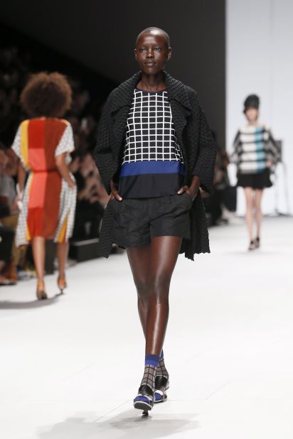 Pictured here, Grace Bol  presents a creation for Issey Miyake during the 2015 Spring/Summer ready-to-wear collection fashion show in Paris.   <br />Born in South Sudan, as a child Bol's family relocated to the US.  The 27-year-old has walked for Givenchy and Vivienne Westwood shows in Paris. 