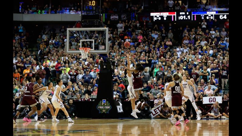 Mississippi State point guard Morgan William <a href="index.php?page=&url=http%3A%2F%2Fbleacherreport.com%2Farticles%2F2700711-uconns-111-game-win-streak-ends-with-ot-buzzer-beater-loss-to-mississippi-state" target="_blank" target="_blank">shoots the game-winning basket</a> against No. 1 Connecticut on Friday, March 31. The Final Four upset ended UConn's 111-game winning streak, an NCAA record.