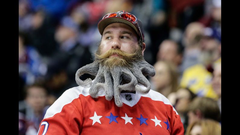 A fan of the NHL's Washington Capitals attends a road game in Denver on Wednesday, March 29.
