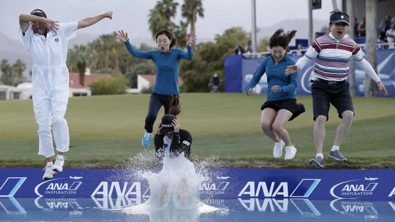 Golfer So Yeon Ryu, front center, leaps into a pond to celebrate her win at the ANA Inspiration on Sunday, April 2. Ryu was joined, from left, by her caddie, her sister, her mother and a member of her management team. Ryu defeated Lexi Thompson in a playoff after Thompson <a href="index.php?page=&url=http%3A%2F%2Fwww.cnn.com%2F2017%2F04%2F03%2Fgolf%2Ftv-viewer-influences-ana-inspiration-lexi-thompson-so-yeon-ryu-four-stroke-penalty%2F" target="_blank">was given a controversial penalty</a> in the middle of her round.