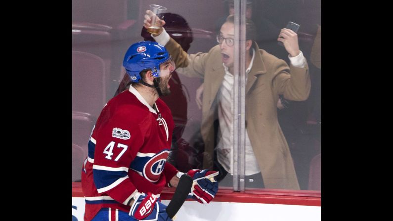 A hockey fan celebrates with Montreal's Alexander Radulov after Radulov scored against Dallas on Tuesday, March 28.