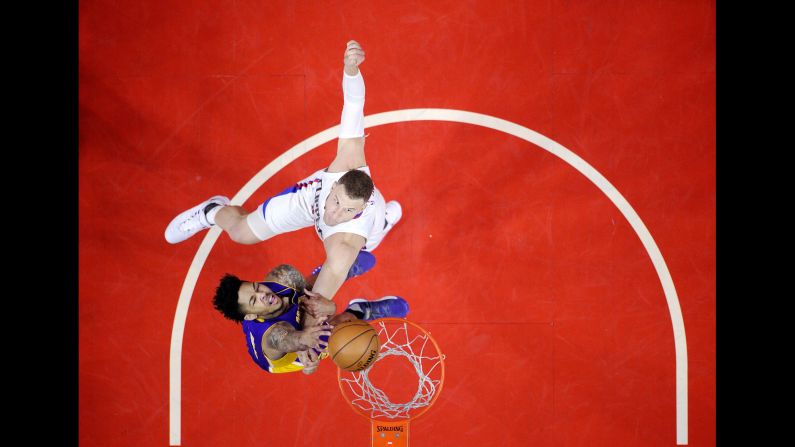 Brandon Ingram, bottom, is fouled by Blake Griffin during an NBA game in Los Angeles on Saturday, April 1. Griffin's Clippers defeated Ingram's Lakers in a game between the city's two teams.