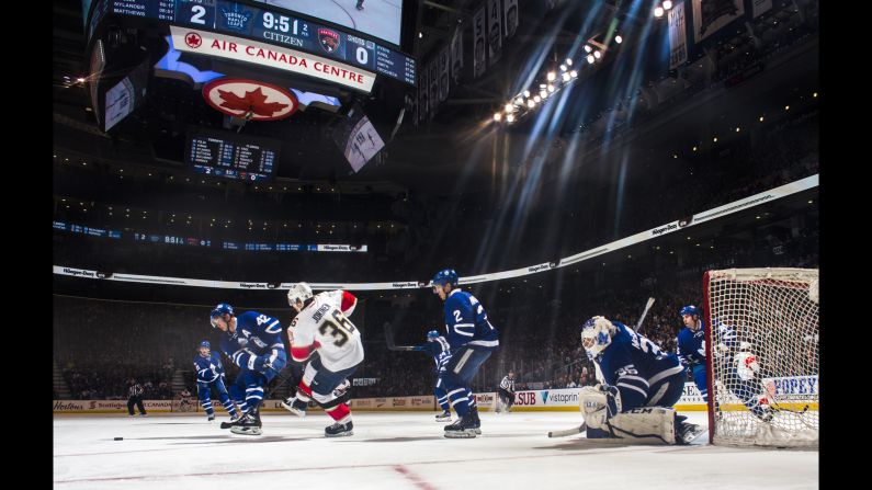 Toronto's Tyler Bozak (No. 42) battles Florida's Jussi Jokinen for the puck during an NHL game in Toronto on Tuesday, March 28.
