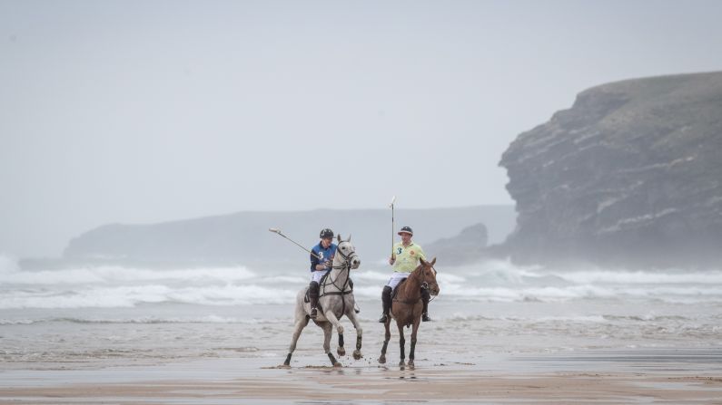 Andy Burgess, left, and Daniel Lowe practice for a beach polo match in Cornwall, England, on Wednesday, March 29.