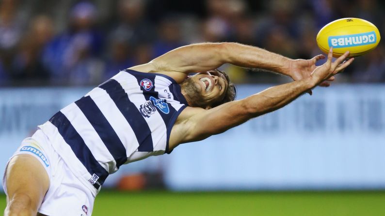 Geelong's Tom Hawkins reaches for the ball during an Australian Football League match in Melbourne on Sunday, April 2.