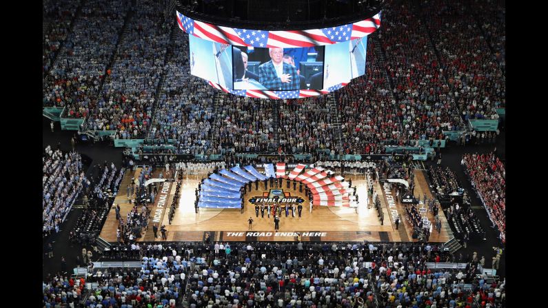 Williams is seen on the jumbotron during the national anthem.