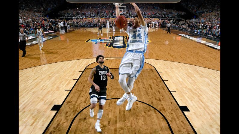 Justin Jackson throws down a dunk to put the exclamation mark on North Carolina's 71-65 victory over Gonzaga in <a href="index.php?page=&url=http%3A%2F%2Fwww.cnn.com%2F2017%2F04%2F03%2Fsport%2Fgallery%2Fmarch-madness-final%2Findex.html" target="_blank">the NCAA Tournament final</a> on Monday, April 3. It is North Carolina's sixth national title and first since 2009.