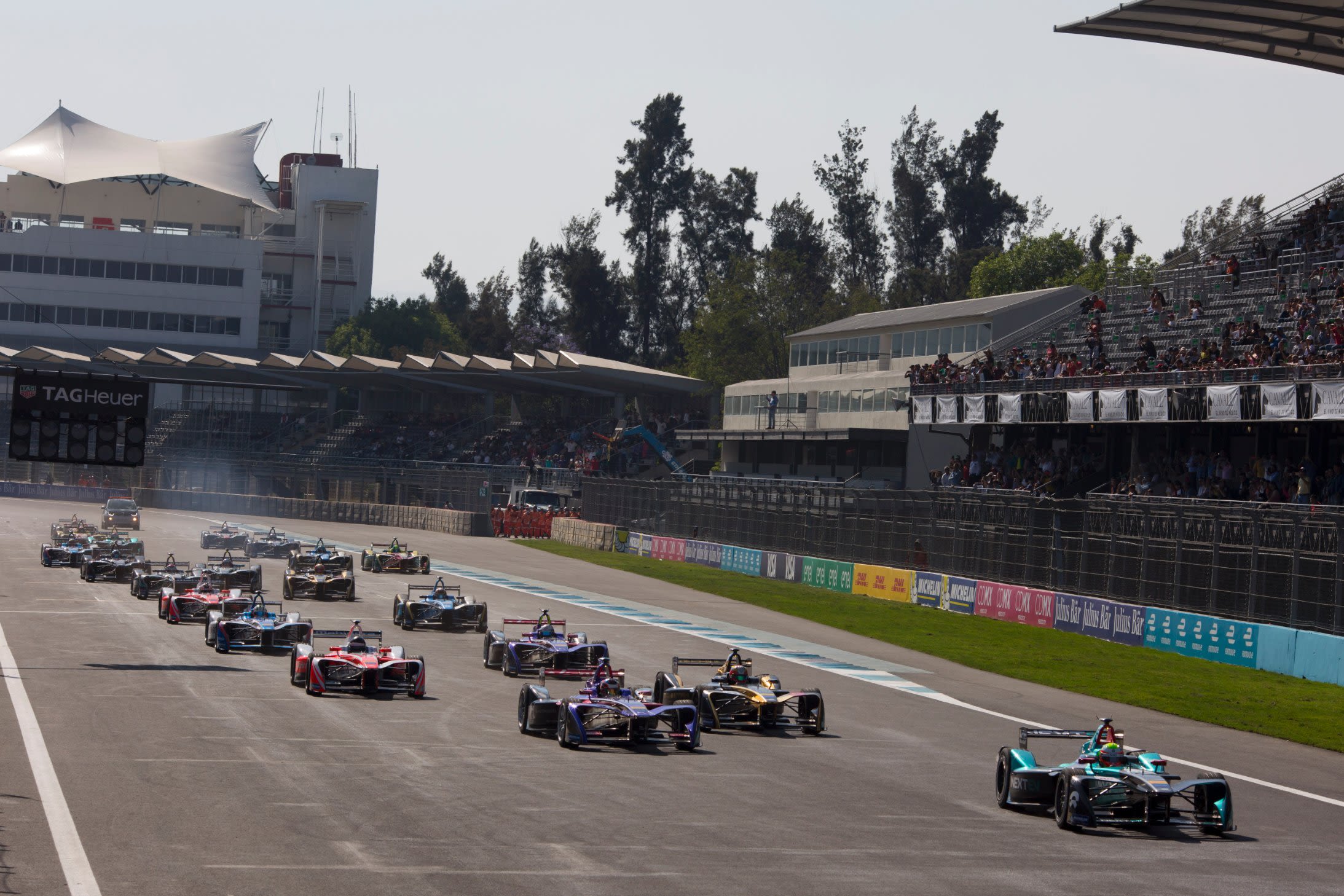 NextEV driver Oliver Turvey leads at the start of the Mexico ePrix at the Autodromo Hermanos Rodriguez. 