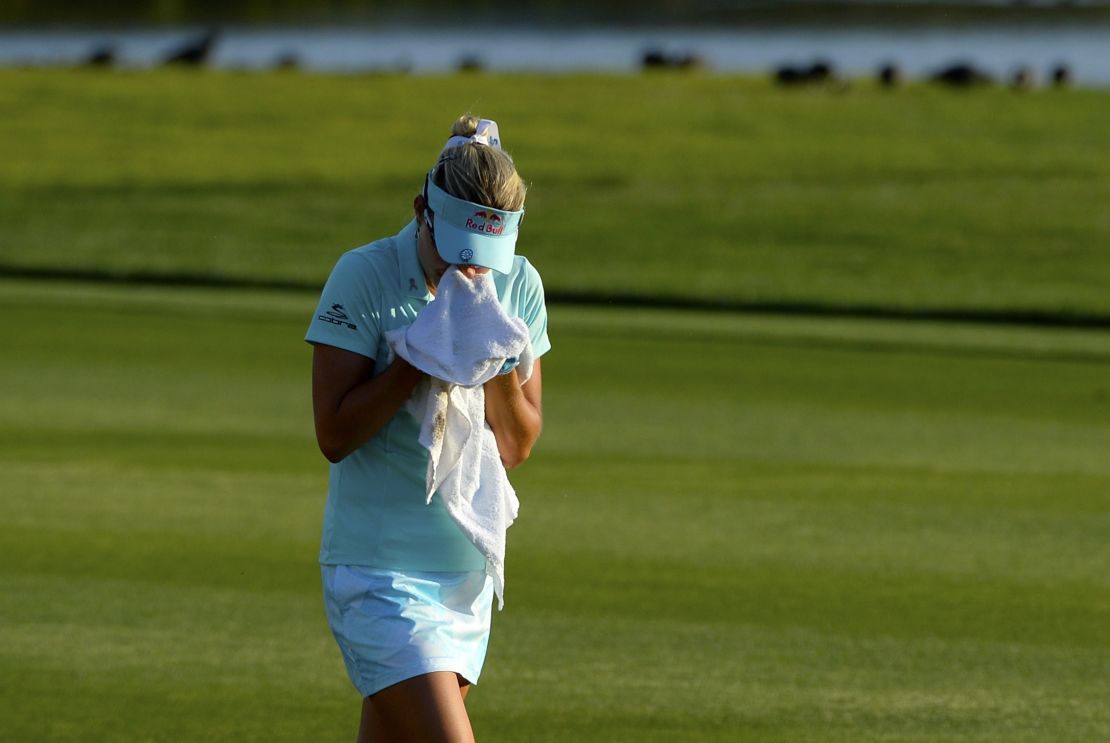 Thompson cries as she walks to the 18th green after her second shot during the final round of the ANA Inspiration 