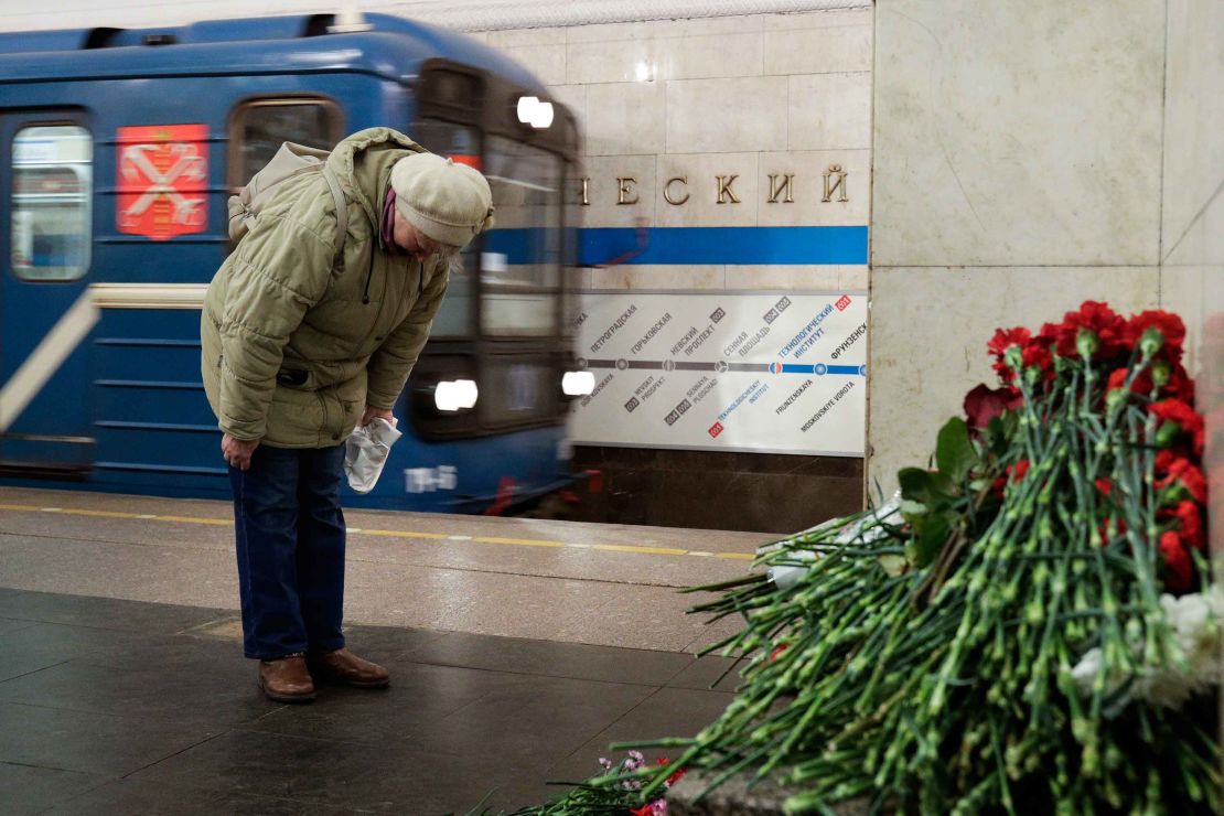 A woman pays her respects at a memorial at the Tekhnologichesky Institute metro station in St. Petersburg on Tuesday. 