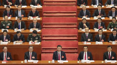 President Xi Jinping (center) attends the 12th National People's Congress (NPC) on March 15 in Beijing, China.