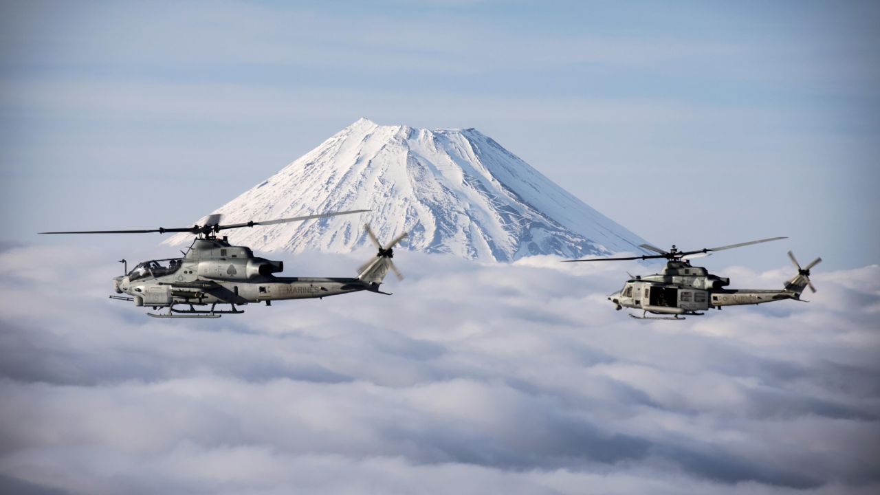 Two Marine Corps helicopters fly past Japan's Mount Fuji on Sunday, March 12.