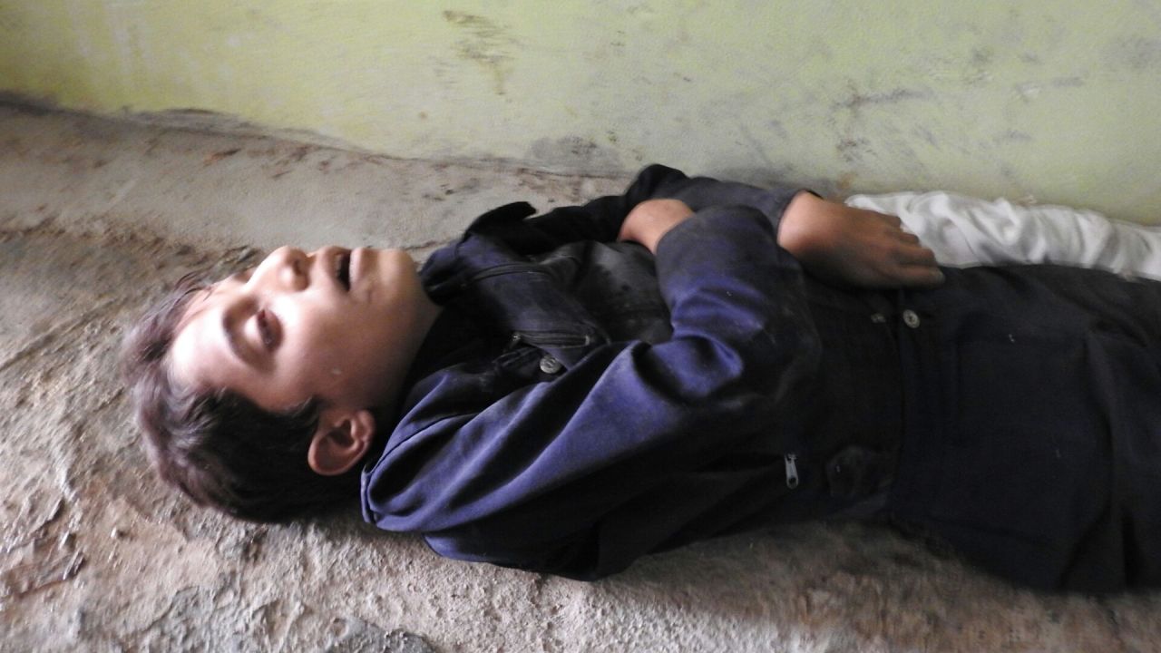 A child's body is seen in Khan Sheikhoun.