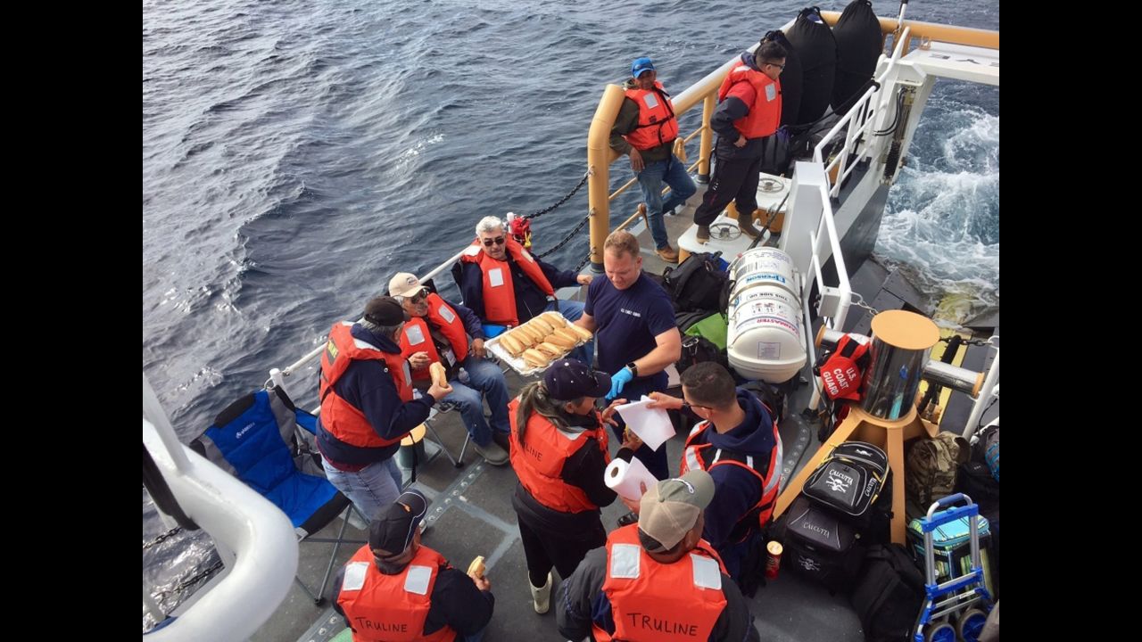 Passengers of the charter fishing vessel Truline are rescued by the US Coast Guard after their boat took on water south of San Clemente Island, California, on Sunday, March 19.