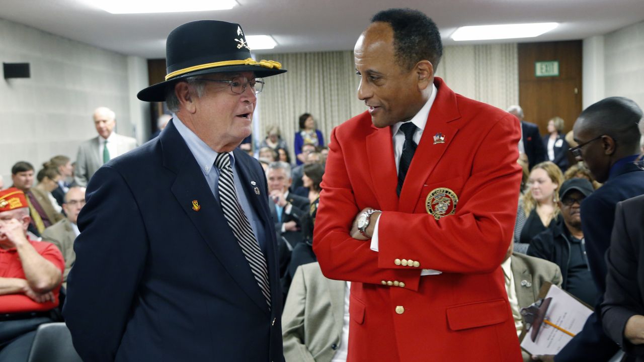Larry Hall, right, chats with Vietnam veteran Allen Wood before confirmation hearings in Raleigh, North Carolina, on Thursday, March 2. Hall was later approved as the state's secretary for military and veterans affairs.