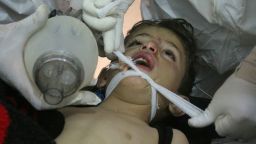 This photo provided Tuesday, April 4, 2017 by the Syrian anti-government activist group Edlib Media Center, which has been authenticated based on its contents and other AP reporting, shows  Syrian doctors treating a child following a suspected chemical attack, at a makeshift hospital, in the town of Khan Sheikhoun, northern Idlib province, Syria. The suspected chemical attack killed dozens of people on Tuesday, Syrian opposition activists said, describing the attack as among the worst in the country's six-year civil war. (Edlib Media Center, via AP)