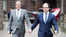 Dutch leader of the Democrats 66 (D66) party Alexander Pechtold (L) and Financial specialist of D66 party Wouter Koolmees (R) arrive for a meeting with other Dutch political parties, in The Hague, on April 3, 2017 while they hold hands as a sign of solidarity for two men who were physical abused after holding hands in public in Arnhem, on 1 April 2017. / AFP PHOTO / ANP / Lex van Lieshout / Netherlands OUT        (Photo credit should read LEX VAN LIESHOUT/AFP/Getty Images)