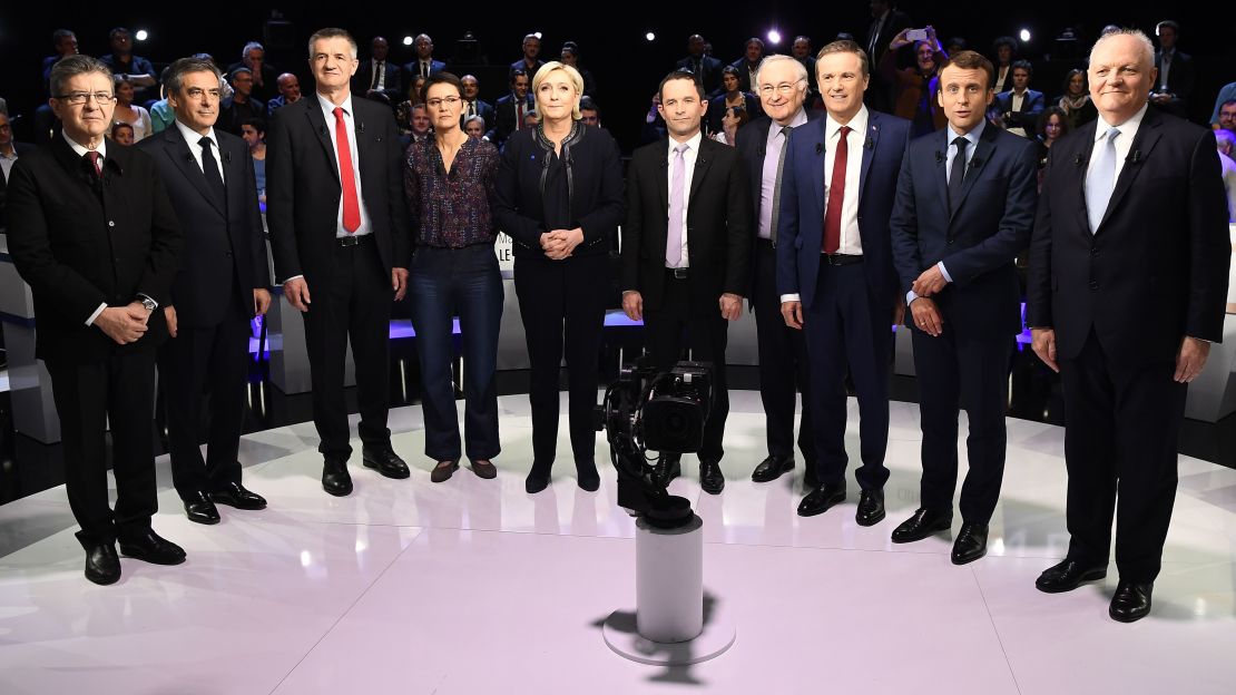 Ten of the 11 candidates in the French presidential election pose for a group photo at the debate.