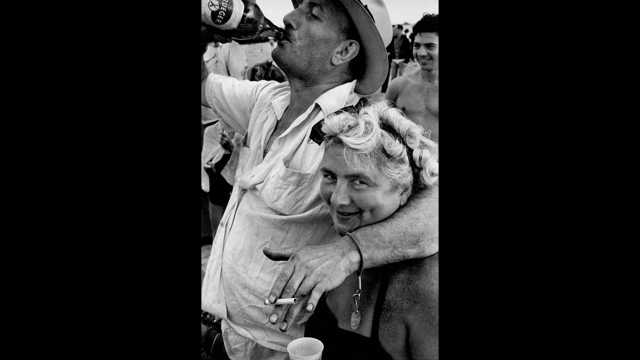 A man swigs Krueger beer at Coney Island in 1952. Bigaignon said Feinstein's work is also known for its humanism. "There's hardly a picture without a human being in it," he said.