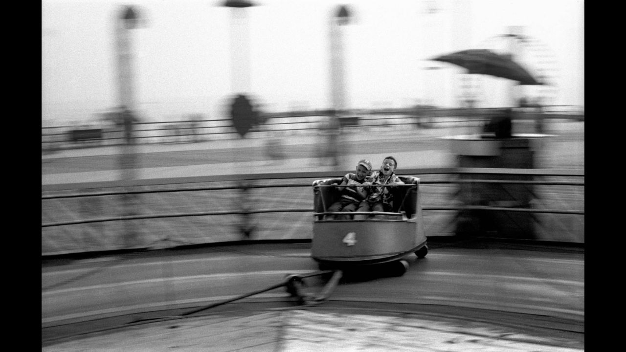 Boys enjoy an amusement ride on Coney Island's boardwalk in 1950. The "Contagious Optimism" exhibition runs through the end of April at the <a href="http://www.thierrybigaignon.com/" target="_blank" target="_blank">Thierry Bigaignon Gallery</a> in Paris. Bigaignon will showcase Feinstein's later work in 2018 and 2019, he said.