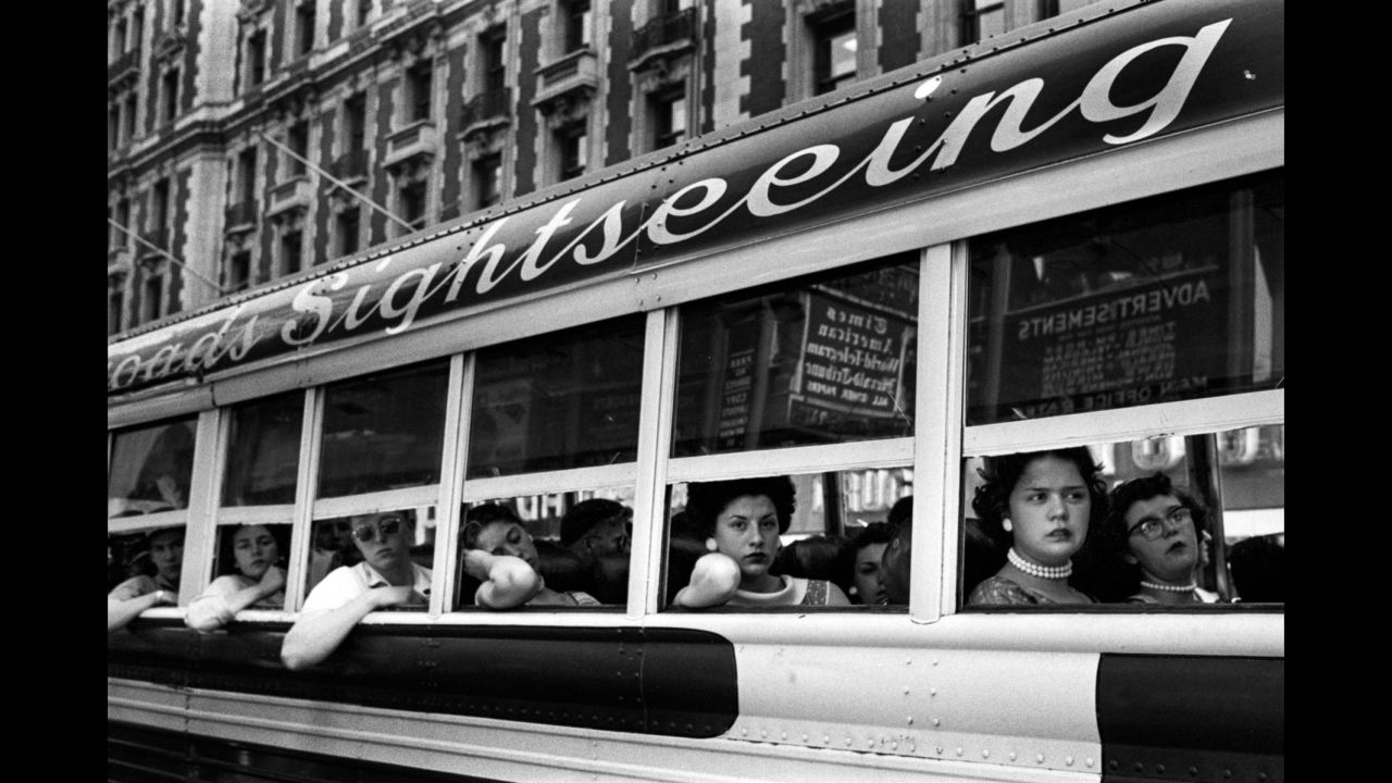 Passengers look out of a sightseeing bus in New York in 1956. Bigaignon said Feinstein's street photography is characterized by a high sense of composition: "He's the kind of photographer who took great care at composing his images in a very fine way, even though he was working very quickly. ... He was very much focused on composition, and that's probably one of the skills he had and he mastered better than the others."