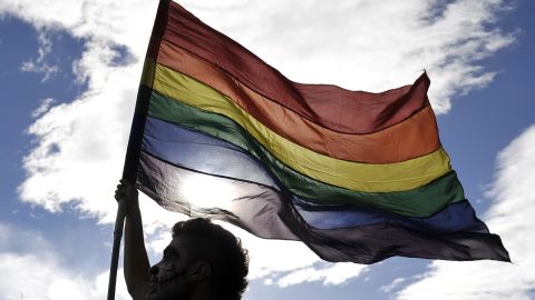 A reveler flutters a rainbow flag during the Gay Pride Parade in Bogota, Colombia on June 28, 2015. AFP PHOTO / GUILLERMO LEGARIA        (Photo credit should read GUILLERMO LEGARIA/AFP/Getty Images)