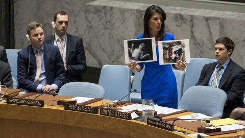 US Ambassador to the UN Nikki Haley holds up photos of victims of the Syrian chemical attack during a meeting of the Security Council.