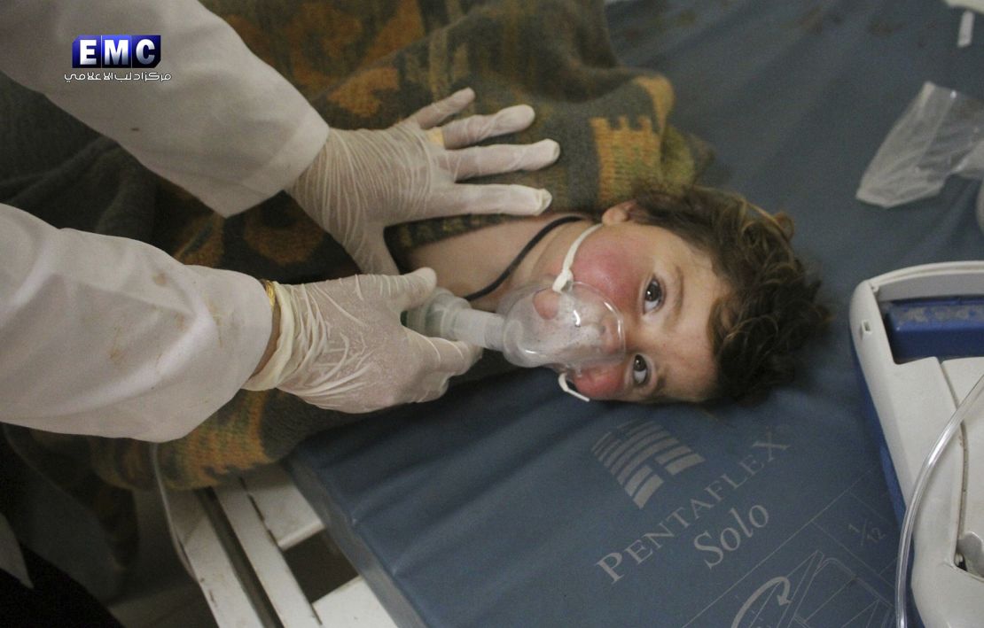 A Syrian doctor treats a child at a makeshift hospital, in the town of Khan Sheikhoun, northern Idlib province, Syria, on April 4.