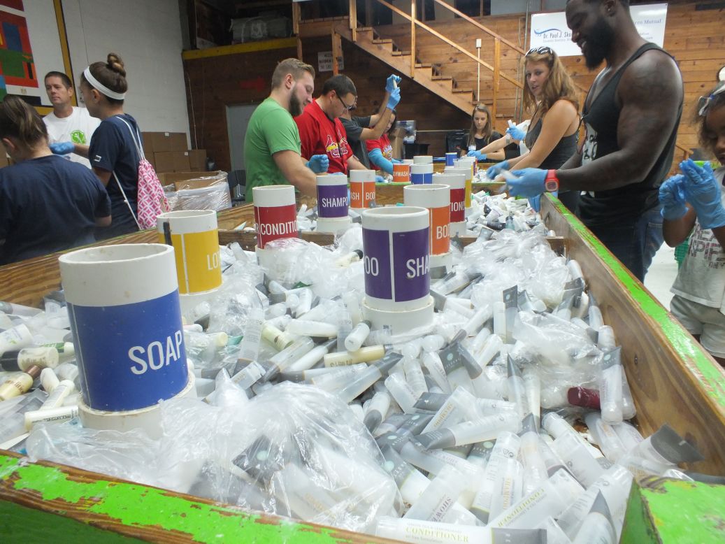 Volunteers sort toiletry products at Clean the World's Orlando recycling plant during an event celebrating Global Handwashing Day in 2016.