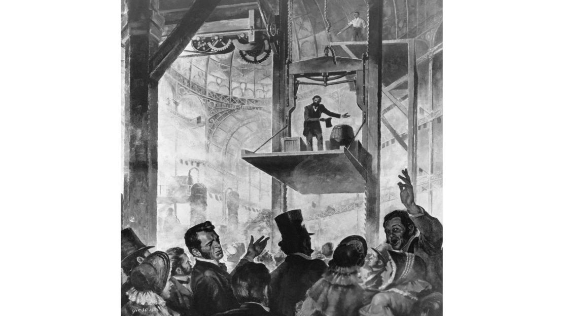 Elisha Graves Otis shows his first elevator in the Crystal Palace, New York City, 1853.