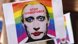 MADRID, SPAIN - AUGUST 23:  A protestor holds up an image representing Russian President Vladimir Putin wearing lipstick during a protest against Russian anti-gay laws opposite the Russian embassy on August 23, 2013 in Madrid, Spain. Gay protestors are protesting Russia's new anti-gay laws and demanding the cancellation of the upcoming 2014 Winter Olympics scheduled to be held in Sochi, Russia.  (Photo by Denis Doyle/Getty Images)