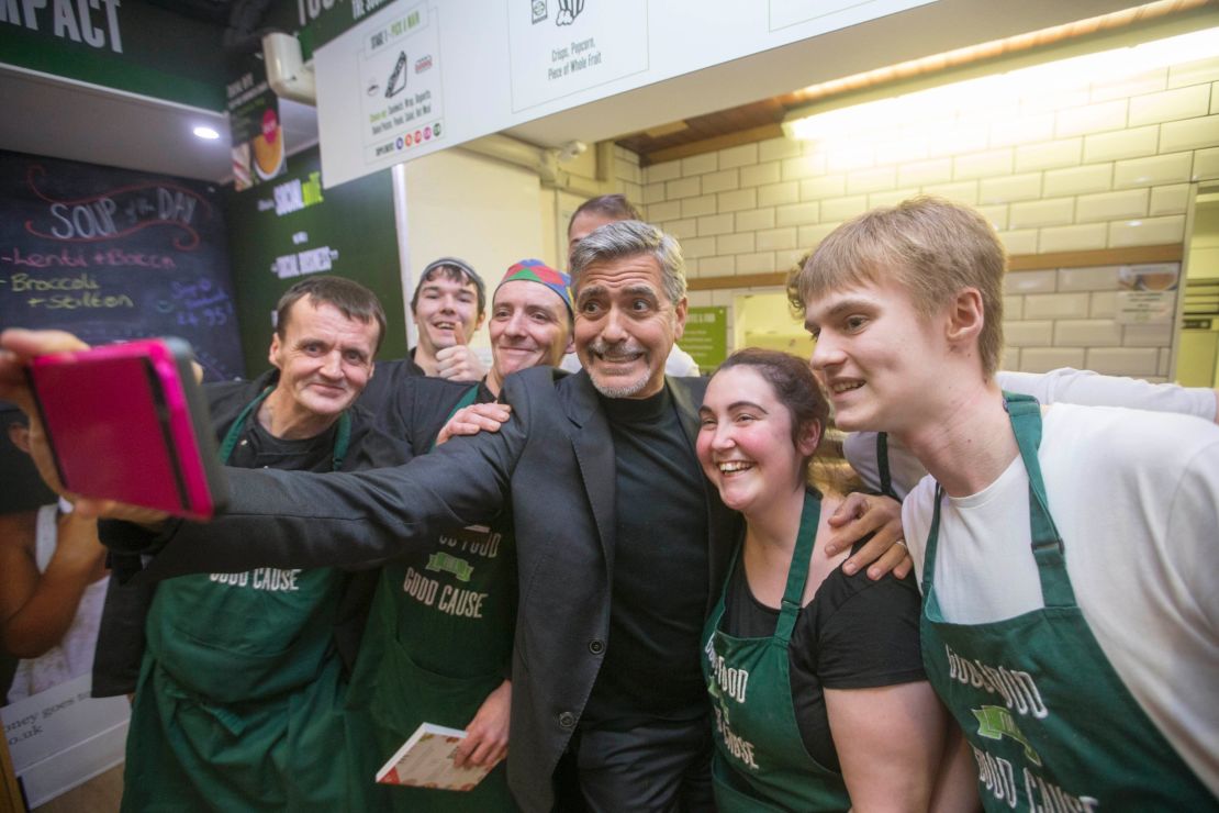 George Clooney met with homeless workers at a cafe which received support from the Hunter Foundation in 2015.