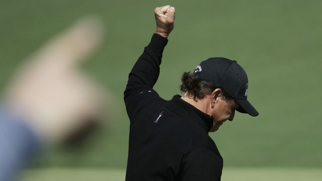 Phil Mickelson reacts after making an eagle on the second hole Thursday. Mickelson, who has won the Masters three times, shot a 1-under 71.