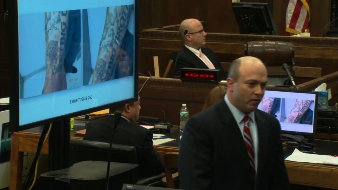 Prosecutor Patrick Haggan shows the jury Aaron Hernandez's tattoos during his double-murder trial.